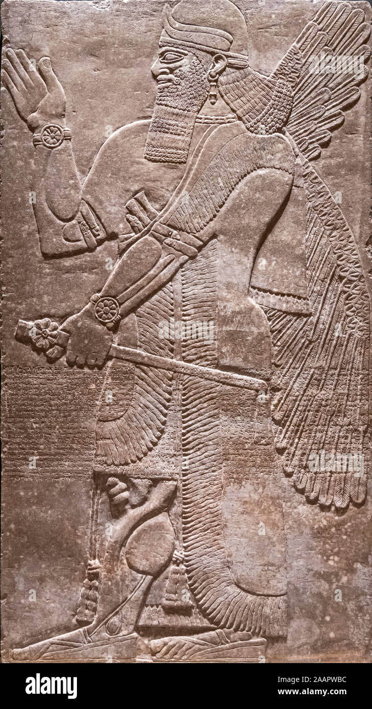 Relief of a Winged Protective Deity ( from the Northwest Palace at Calakh), Assyrian, reign of Ashurnasirpal II, 883–859 B.C. Stock Photo