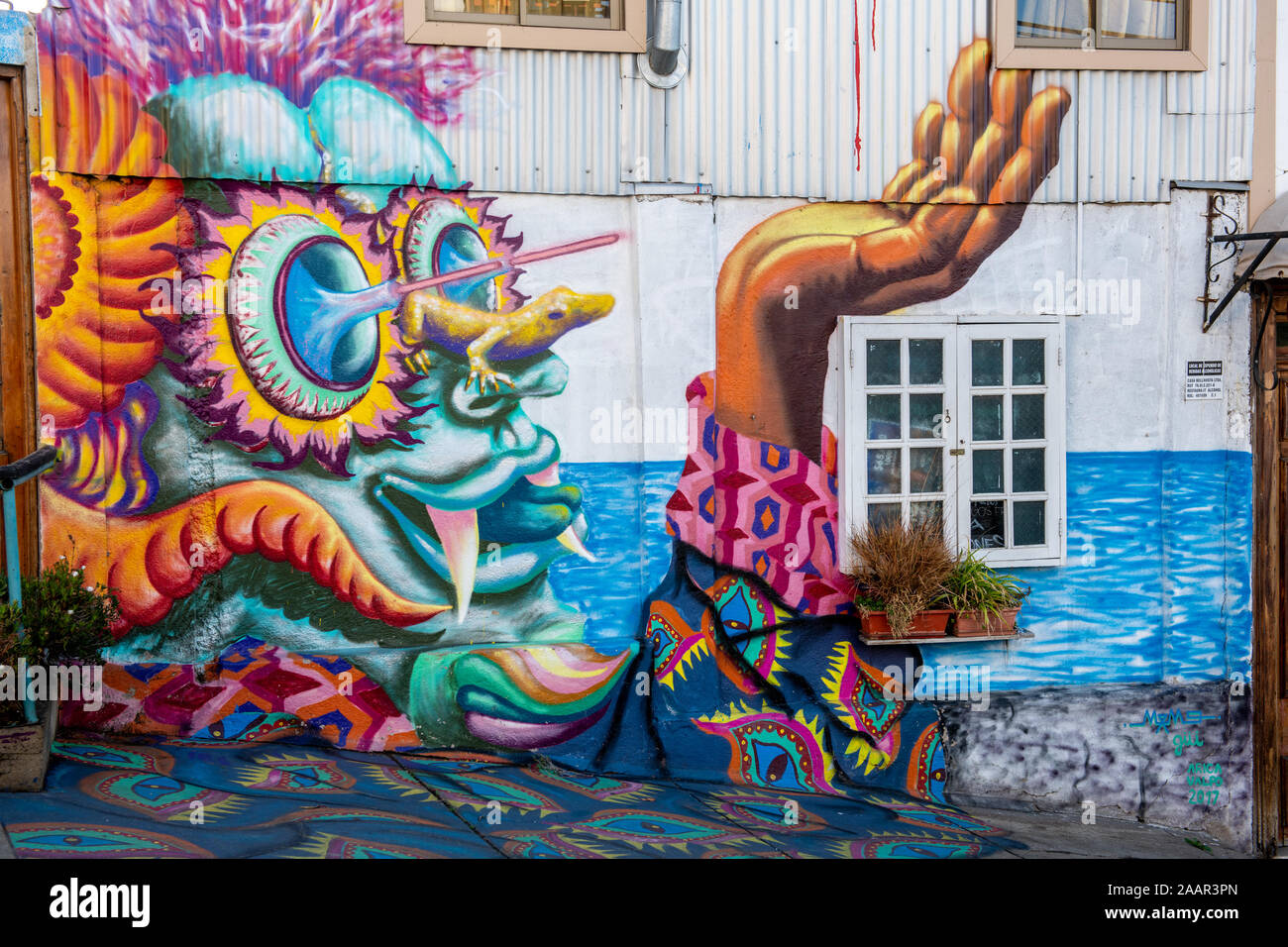 Colorful graffiti street art adorns the walls and buildings of