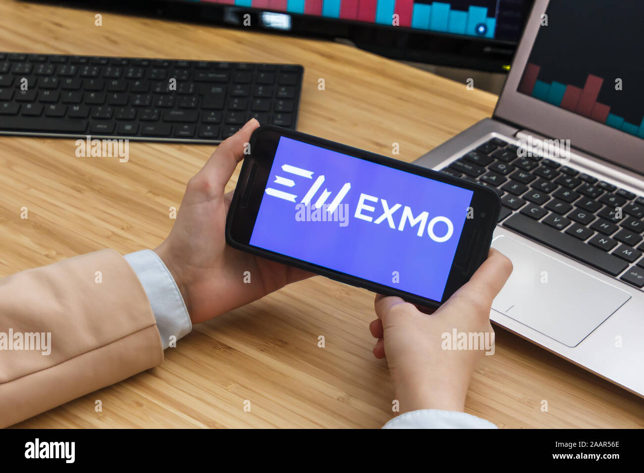 EXMO Cryptocurrency Exchange Market. Female Trader Hands Holding the  Smartphone Using Application. Crypto Background Concept, San Francisco  Stock Photo - Alamy