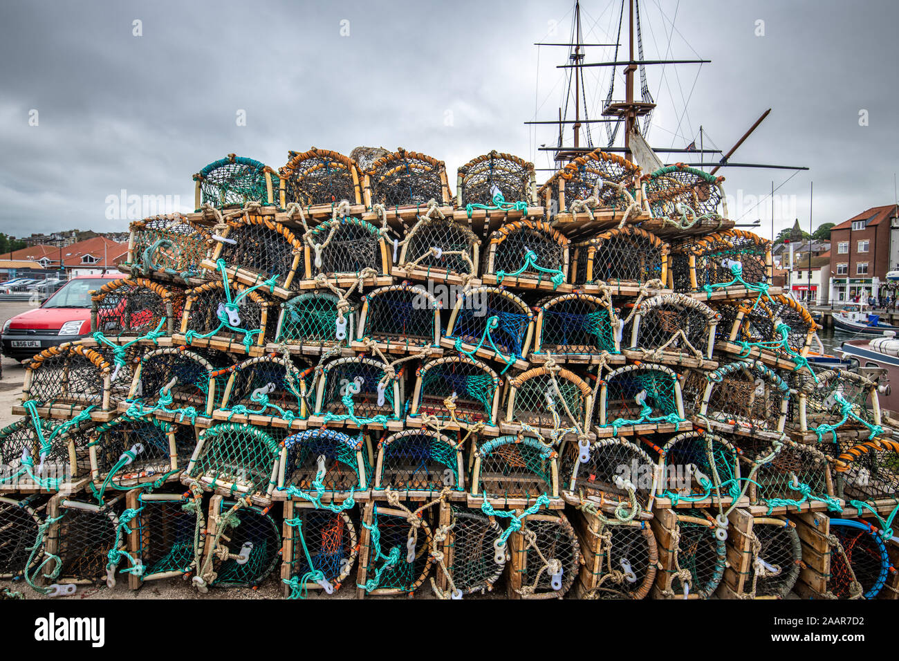 Fishing nets and crabbing crates sit on the docks of Whitby, United