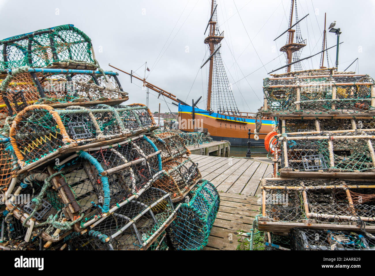 Fishing nets and crabbing crates sit on the docks of Whitby, United