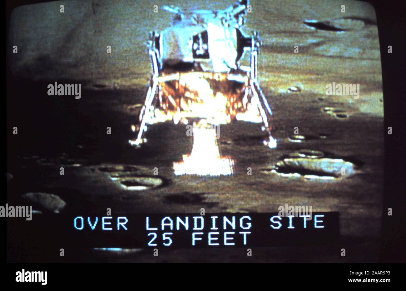 Teleclip - Lunar Module 'simulation' of Apollo 17 - Moon Landing with 'Over Landing Site 25 feet' subtitle; photograph taken directly from TV screen - circa 1972 Stock Photo