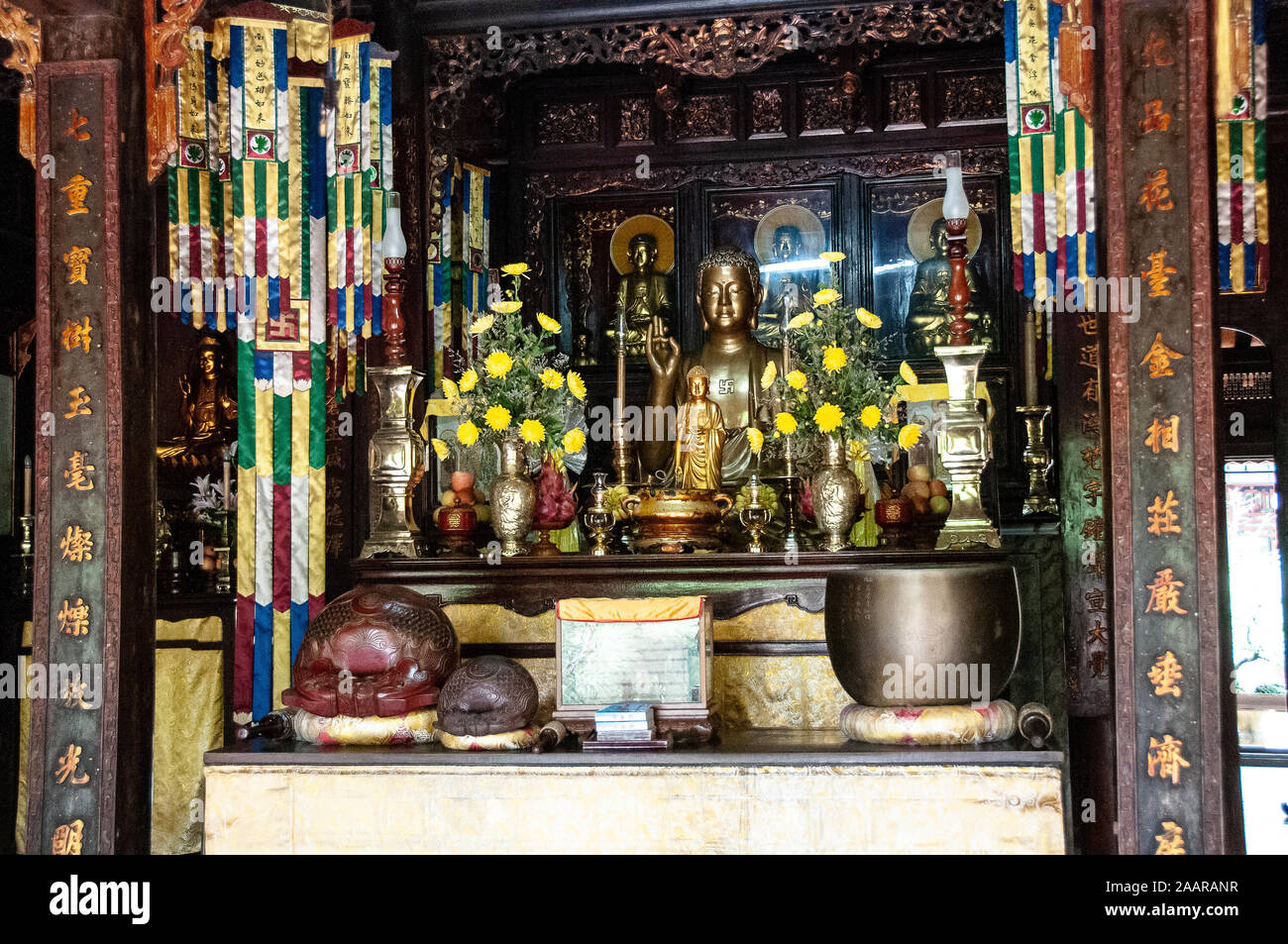 Altar with golden vases is always covered with fresh flowers inside the
