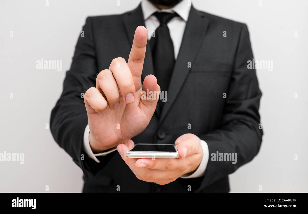 Male human wear formal work suit hold smart hi tech smartphone use one ...