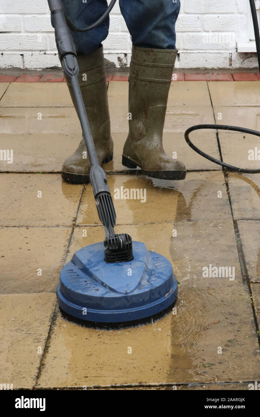 Cleaning patio paving slabs with pressure washer Stock Photo Alamy