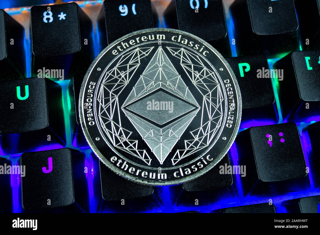 Coin cryptocurrency ethereum classic close-up of the colour-coded keyboard background Stock Photo