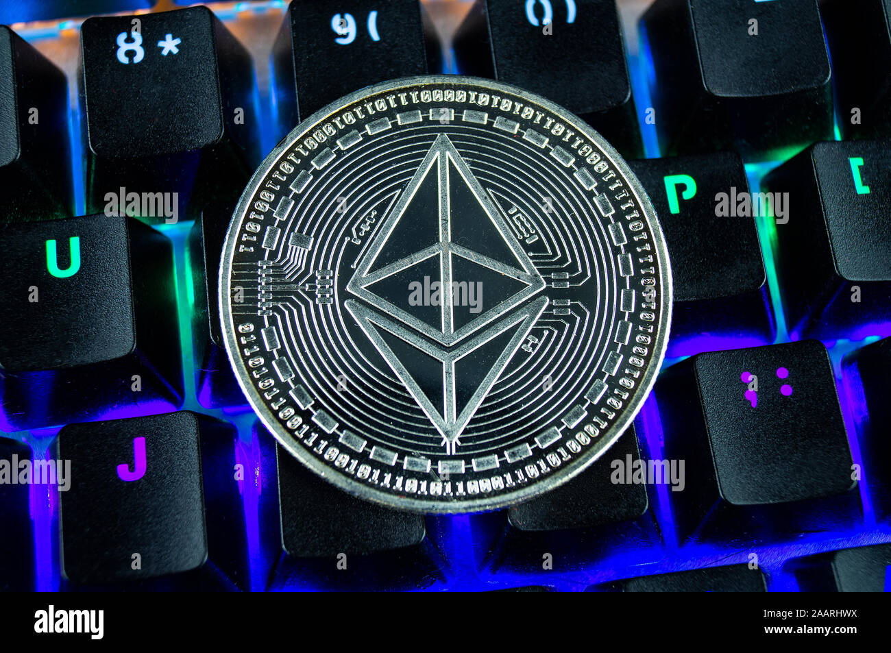 Coin cryptocurrency ethereum classic close-up of the colour-coded keyboard background Stock Photo