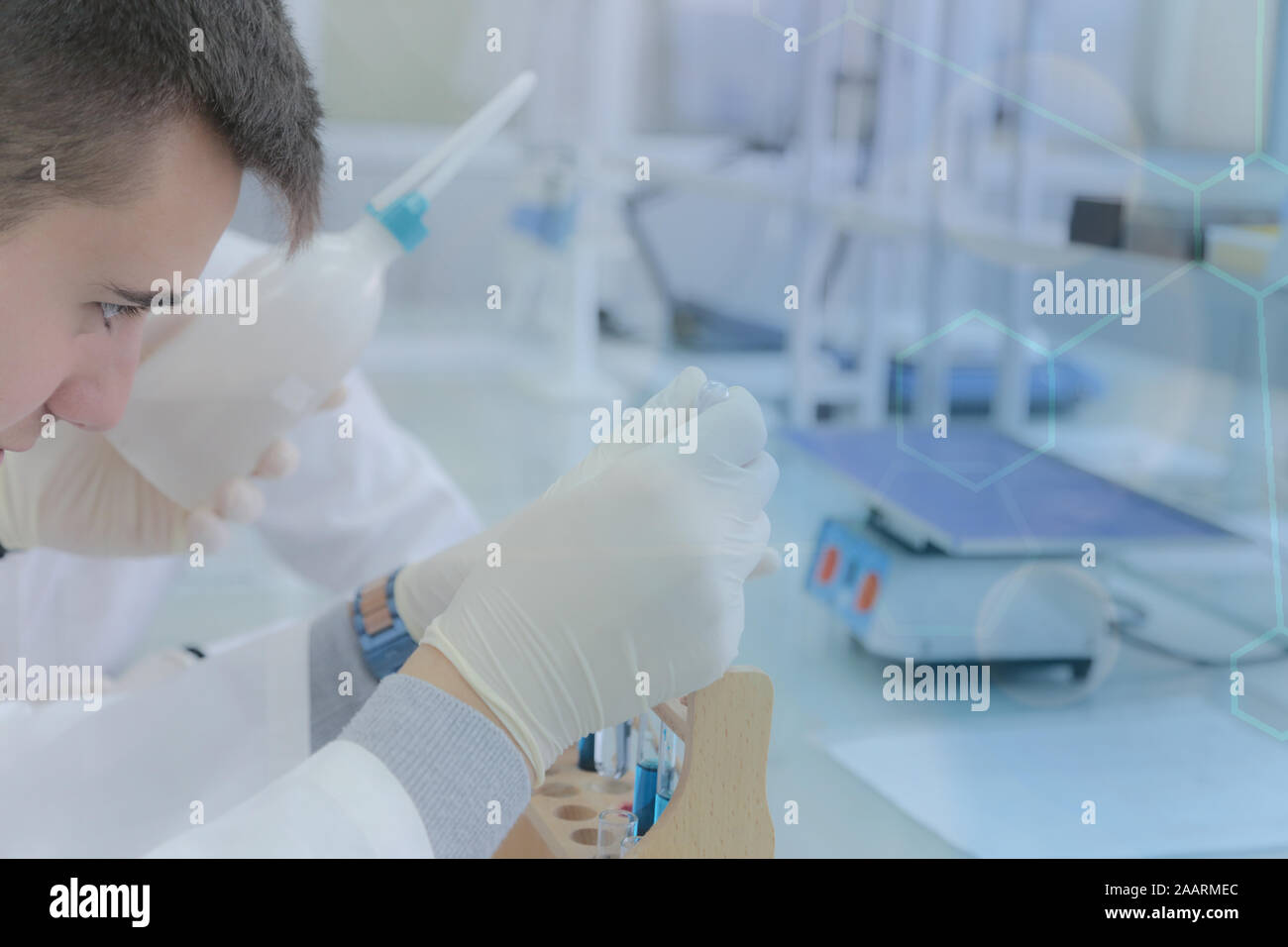 Young male scientist doing experiments in laboratory Stock Photo