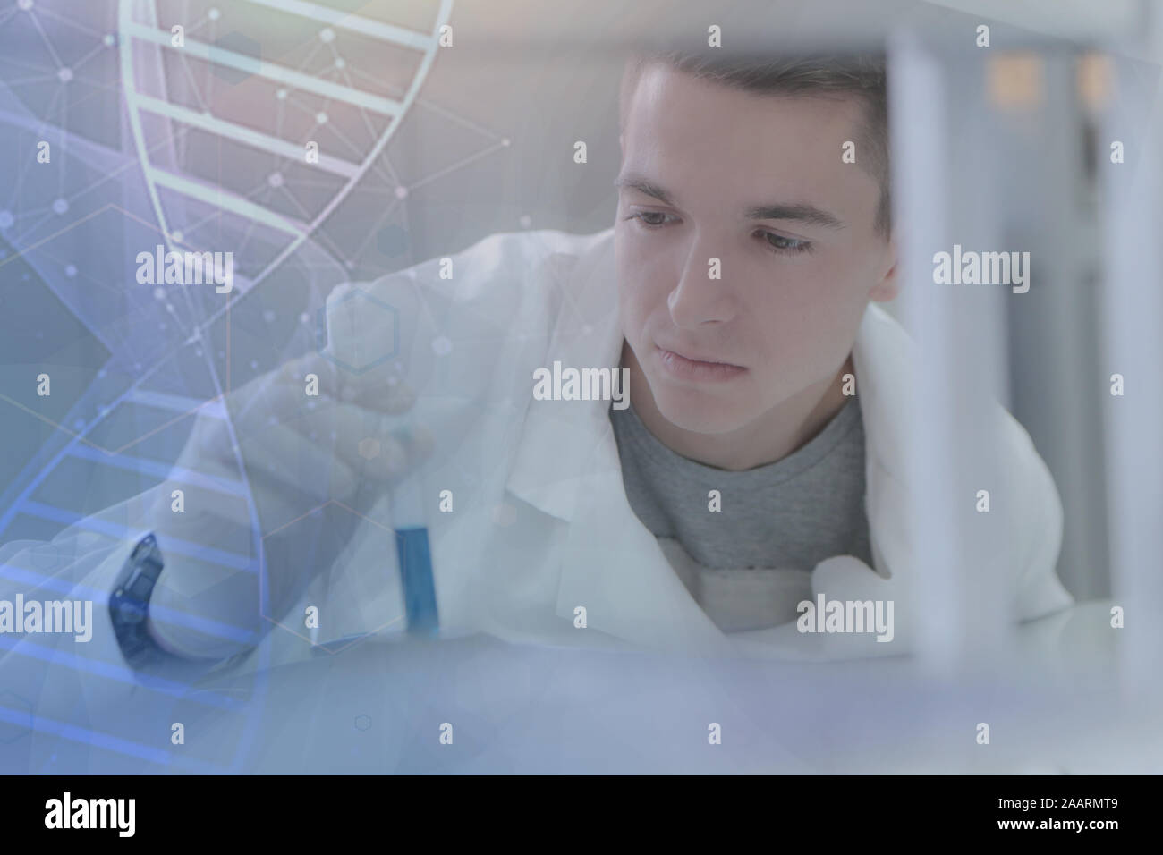 Young male scientist doing experiments in laboratory Stock Photo