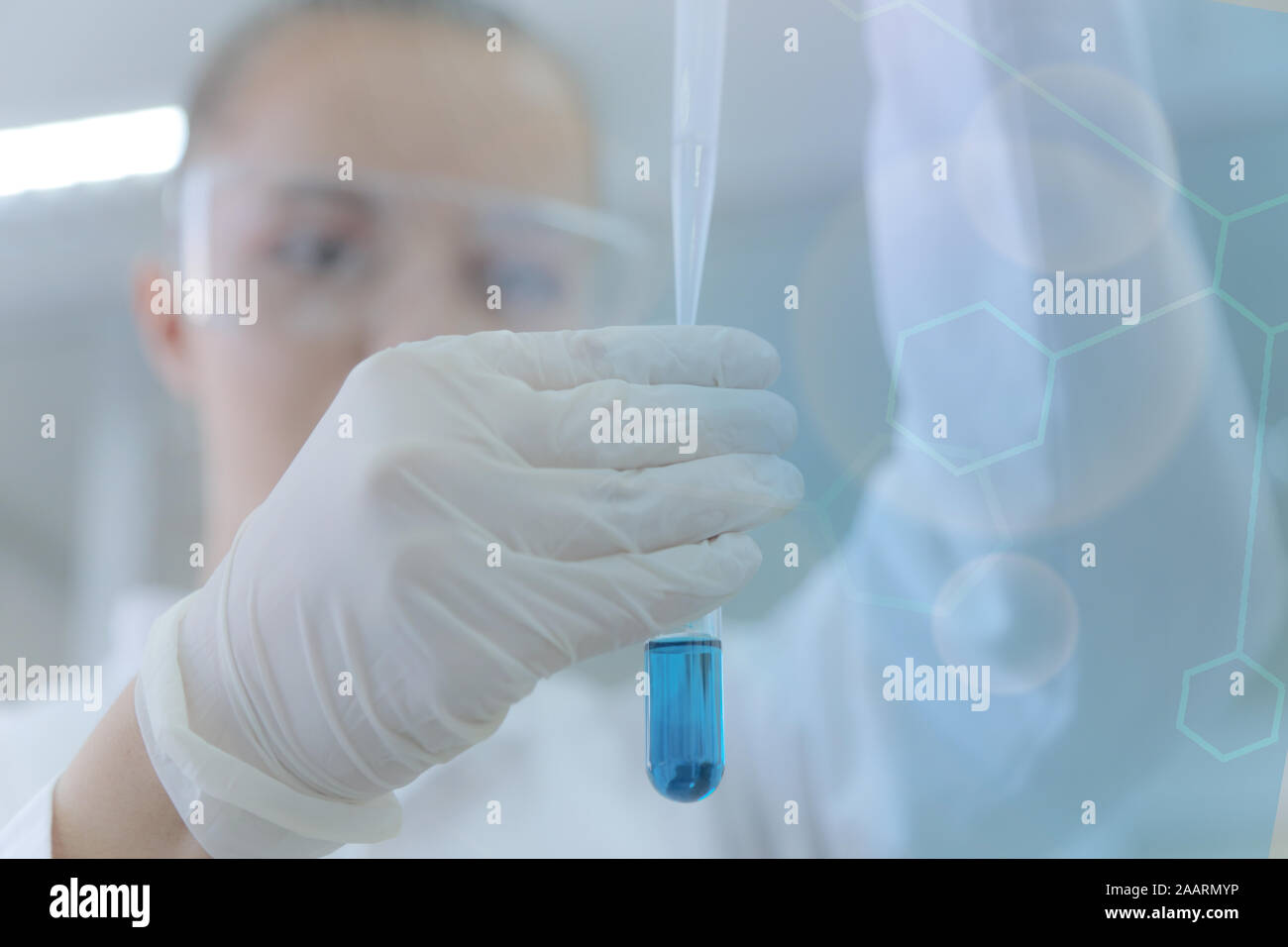 Young female scientist doing experiments in laboratory Stock Photo