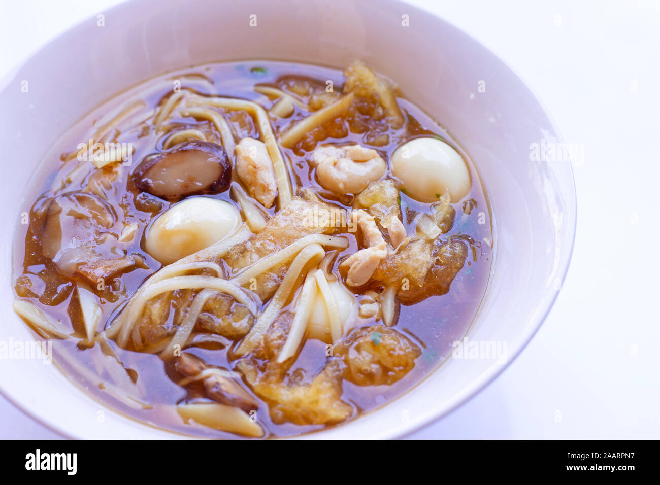 Braised fish maw in red gravy in bowl on white background Stock Photo Alamy