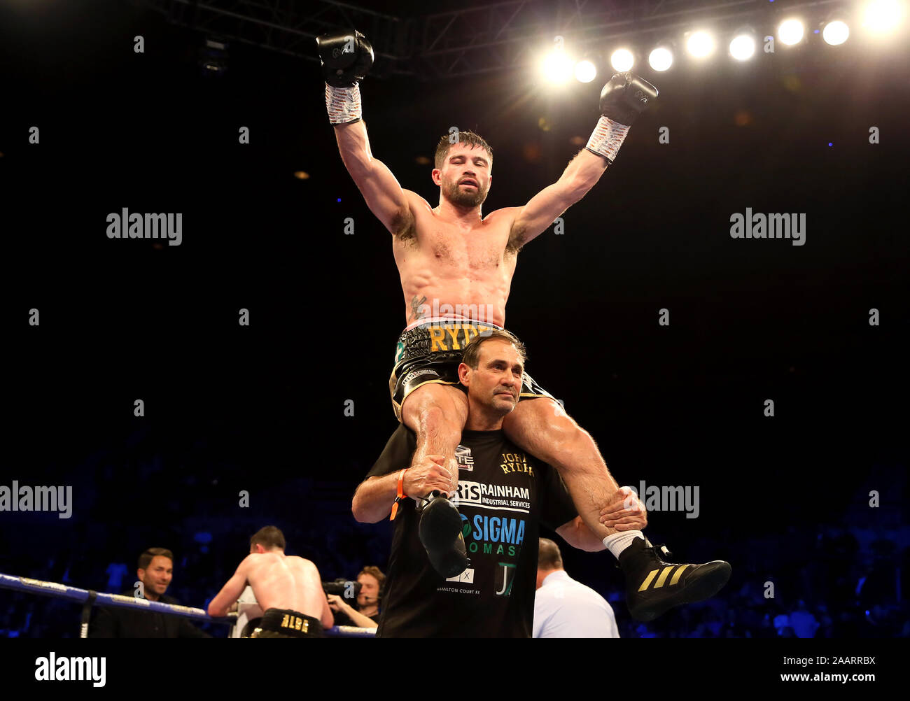 John Ryder celebrates after the WBA World, WBC Diamond & Ring Magazine ...