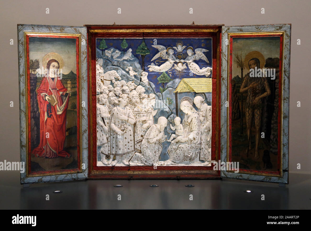 Factitious triptych with doors with paints added. Glazed terracotta. 1475. Della Robbia workshop. Museu Pedralbes, Barcelona. Spain. Stock Photo