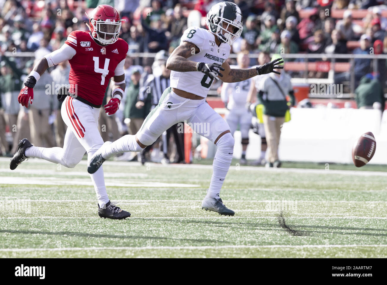 Piscataway, New Jersey, USA. 23rd Nov, 2019. Left Rutgers TIM BARROW defends against Michigan State's JALEN NAILER of a broken play during game action at SHI Stadium in Piscataway, New Jersey. OMichigan State shut out Rutgers 27-0 Credit: Brian Branch Price/ZUMA Wire/Alamy Live News Stock Photo