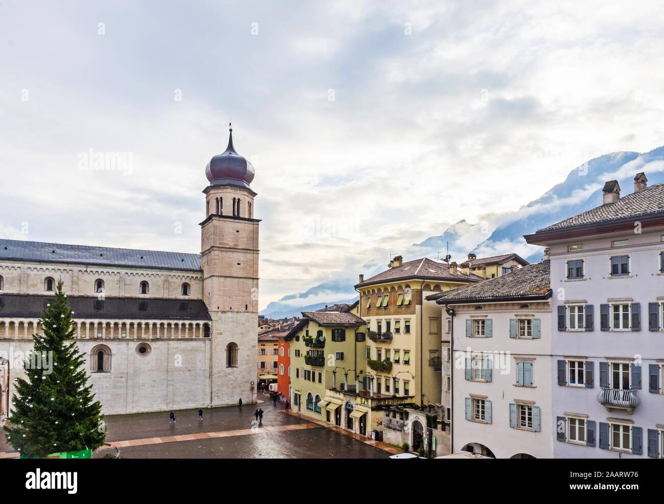 Trento, Italy (21st November 2019) - Piazza Duomo, main Trento's square, with the cathedral, some of its old houses and the Alps in the background Stock Photo