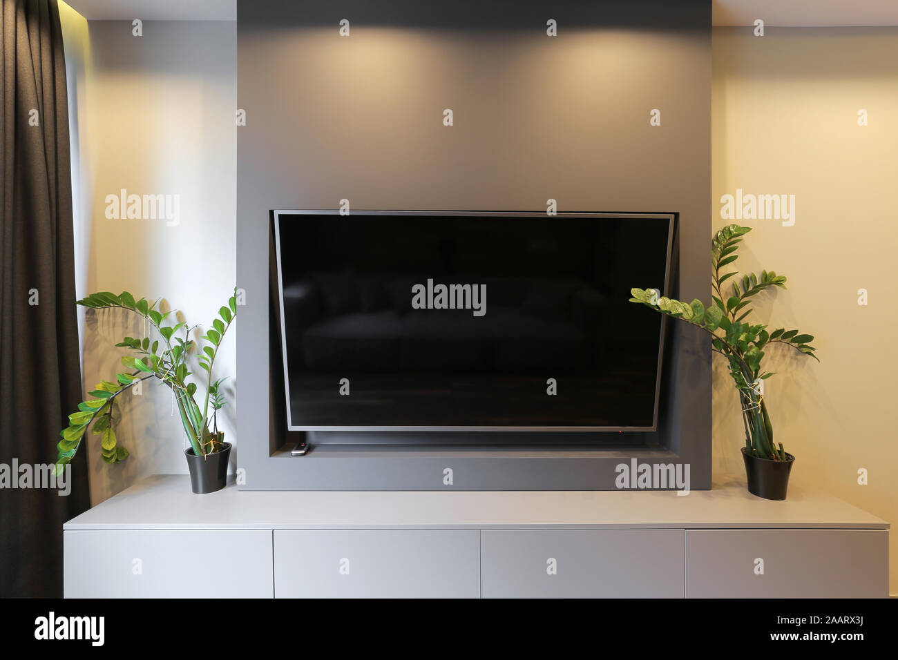 TV hanging on the wall at home Stock Photo Alamy
