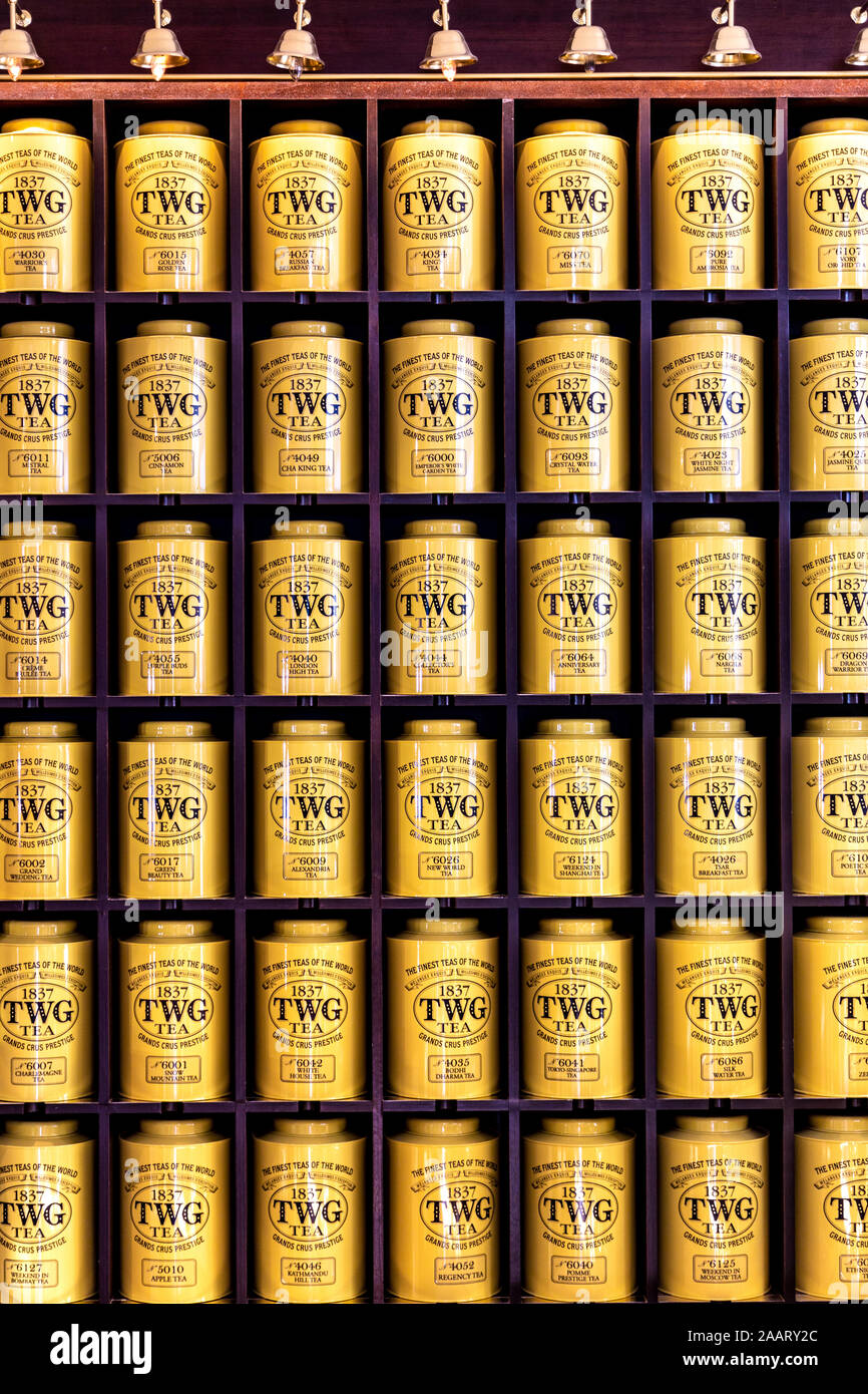 Yellow tea canisters on shelves at TWG Tea Shop in Leicester Square, London, UK Stock Photo