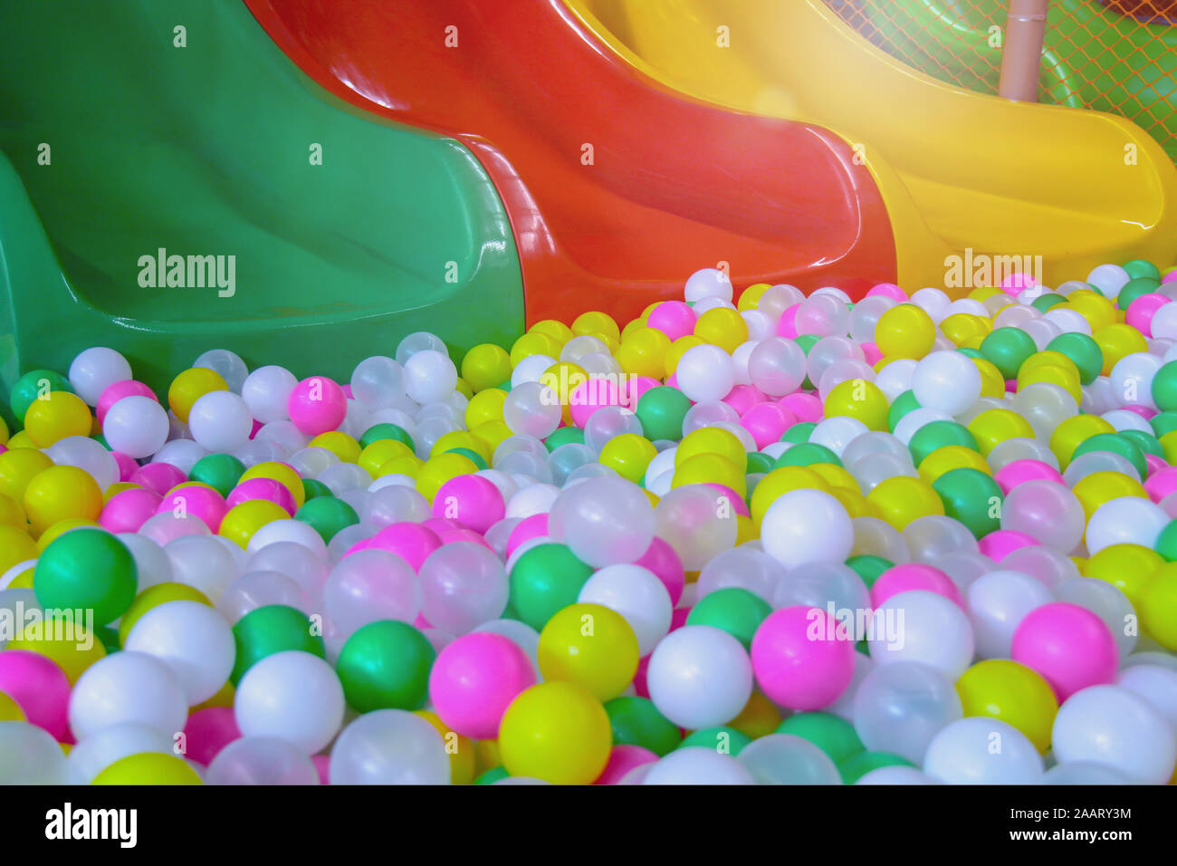 Colored balls and slider for kids in the playground Stock Photo Alamy