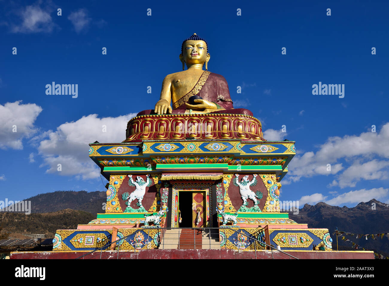 India, Tawang, Arunachal Pradesh, India - The colour prayer buddha statue on the hillside which surrounding Tawang Stock Photo