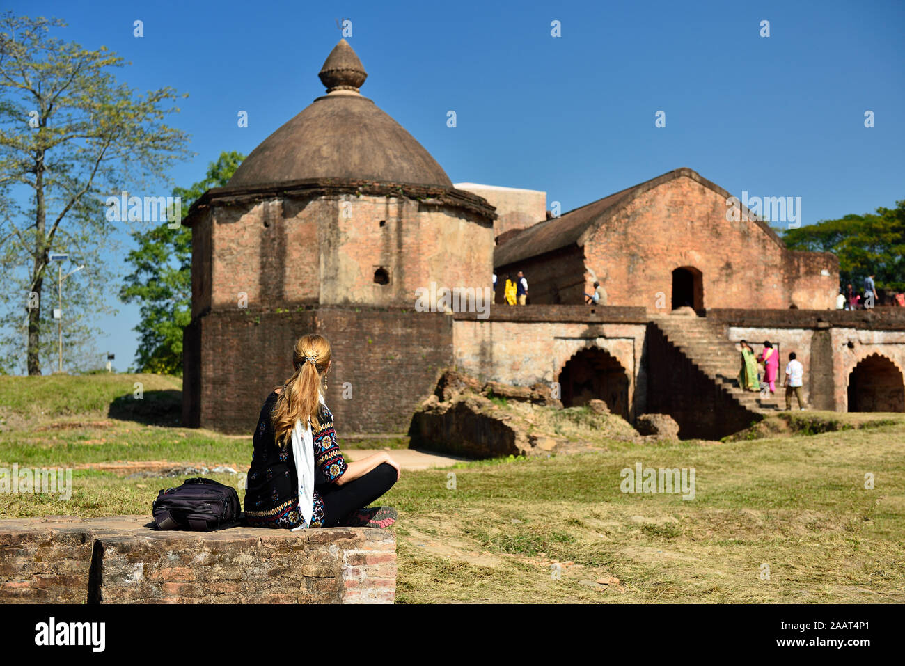 India, Assam, Tourist looking on the Talatal Ghar the grandest examples of Tai Ahom architecture located close the Sivasagar Town Stock Photo