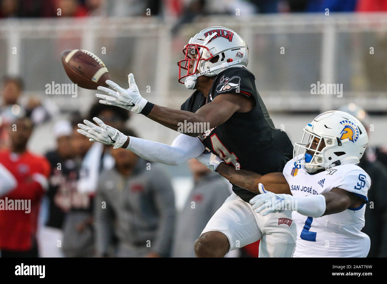 Las Vegas, NV, USA. 23rd Nov, 2019. UNLV Rebels wide receiver Randal Grimes (4) catches the football in front of San Jose State Spartans cornerback Zamore Zigler (2) during the NCAA Football game featuring the San Jose State Spartans and the UNLV Rebels at Sam Boyd Stadium in Las Vegas, NV. The UNLV Rebels defeated the San Jose State Spartans 38 to 35. Christopher Trim/CSM/Alamy Live News Stock Photo