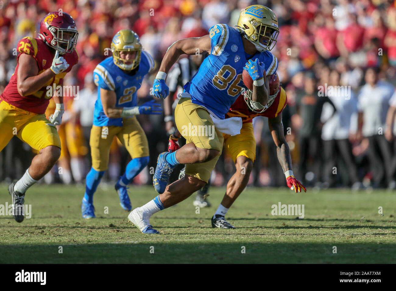 UCLA Bruins tight end Devin Asiasi (86) runs after a catch during the UCLA Bruins vs USC Trojans football game at United Airlines Field at the Los Angeles Memorial Coliseum on Saturday November 23, 2019 (Photo by Jevone Moore) Stock Photo