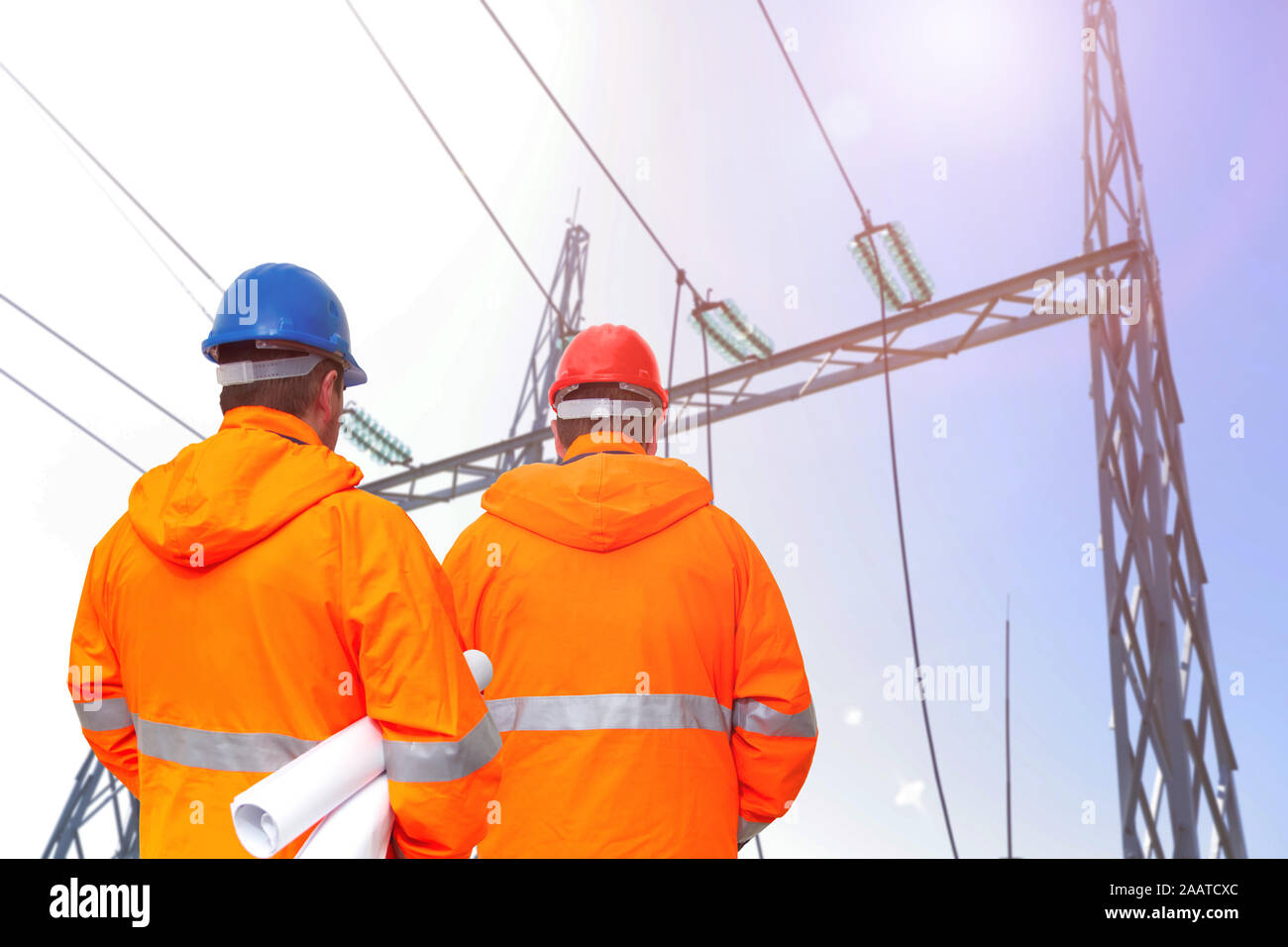 Two electrical engineers in substation, back view Stock Photo