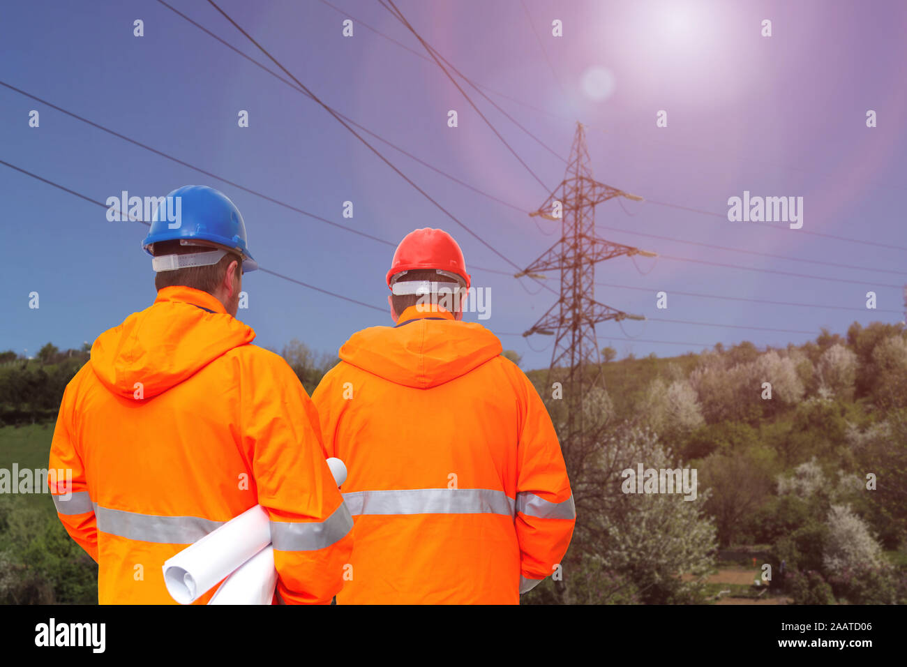 Two electrical engineers in substation, back view Stock Photo