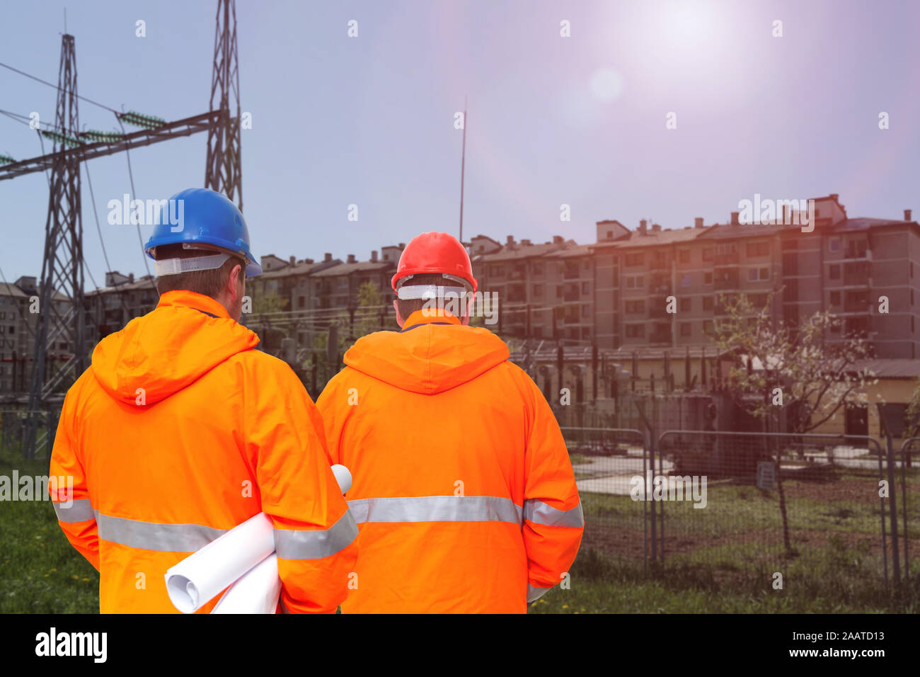 Two electrical engineers in substation, back view Stock Photo