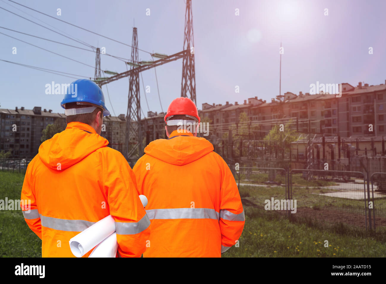 Two electrical engineers in substation, back view Stock Photo