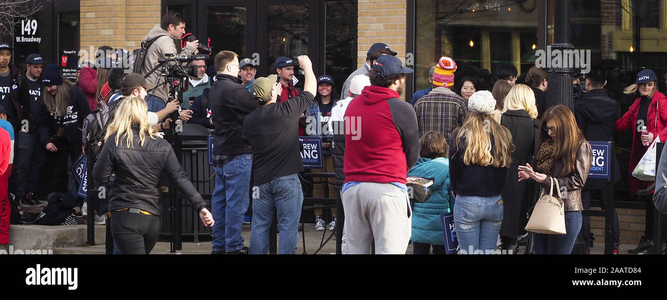 Council Bluffs, IOWA, USA. 23rd Nov, 2019. Entrepreneur and 2020 Democratic presidential candidate hopeful ANDREW YANG is lost in the crowd of media and supporters as he walks down a sidewalk while campaigning in Council Bluffs, Iowa Saturday, Nov. 23, 2019. Credit: Jerry Mennenga/ZUMA Wire/Alamy Live News Stock Photo
