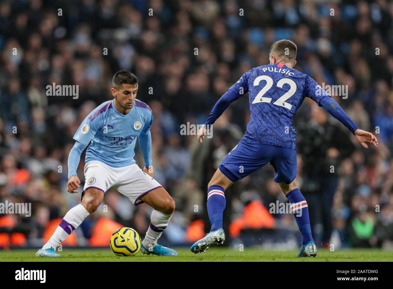 23rd November 2019, Etihad Stadium, Manchester, England; Premier League, Manchester City v Chelsea : Joao Cancelo (27) of Manchester City loos for a way past Christian Pulisic (22) of Chelsea  Credit: Mark Cosgrove/News Images Stock Photo