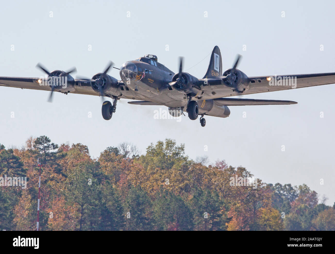 MONROE, NC (USA) - November 9, 2019:  A B-17 bomber used in the filming of the movie 'Memphis Belle' flies at treetop level at an air show. Stock Photo