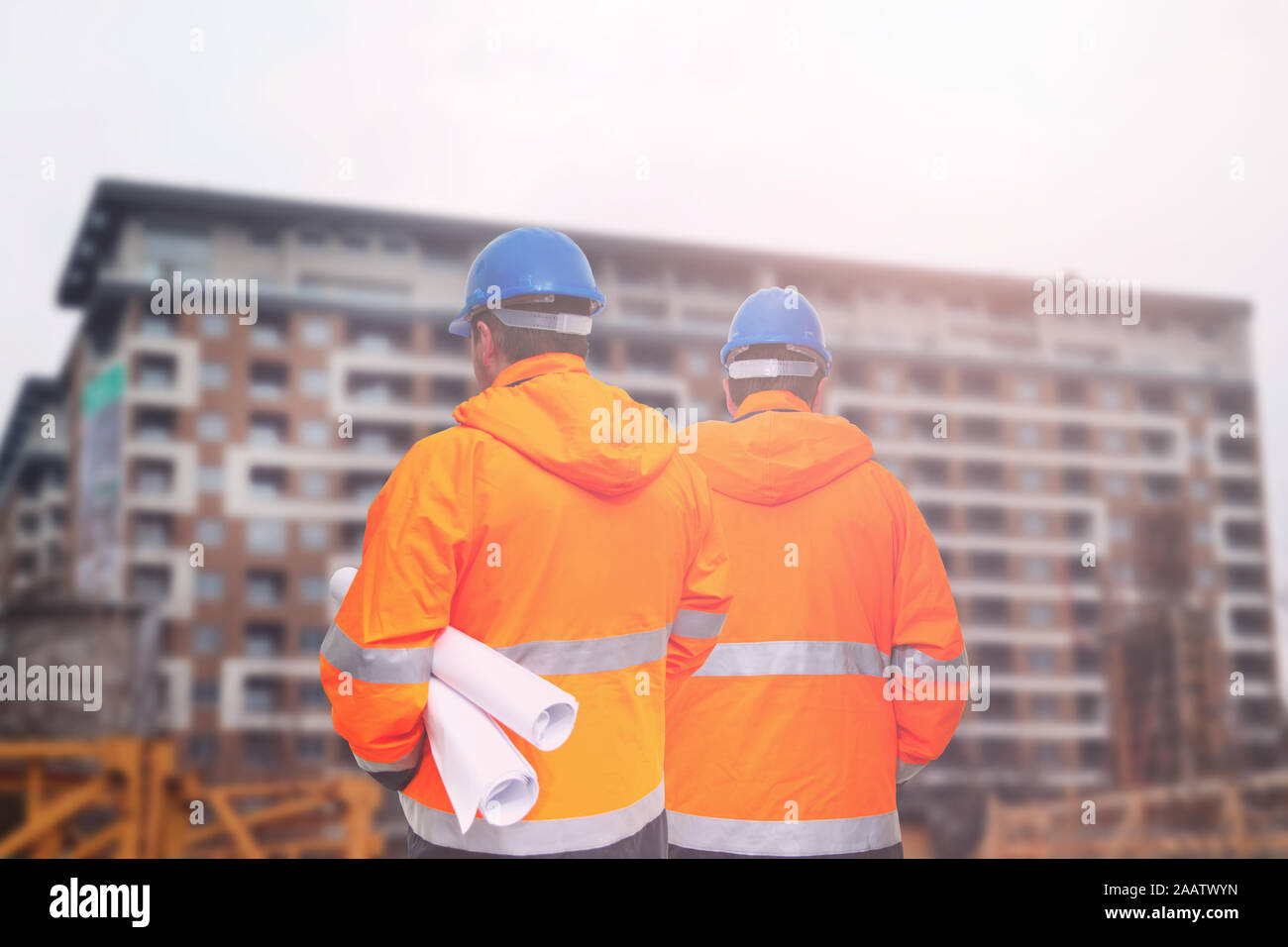 Two engineers looking at consrtuction site Stock Photo