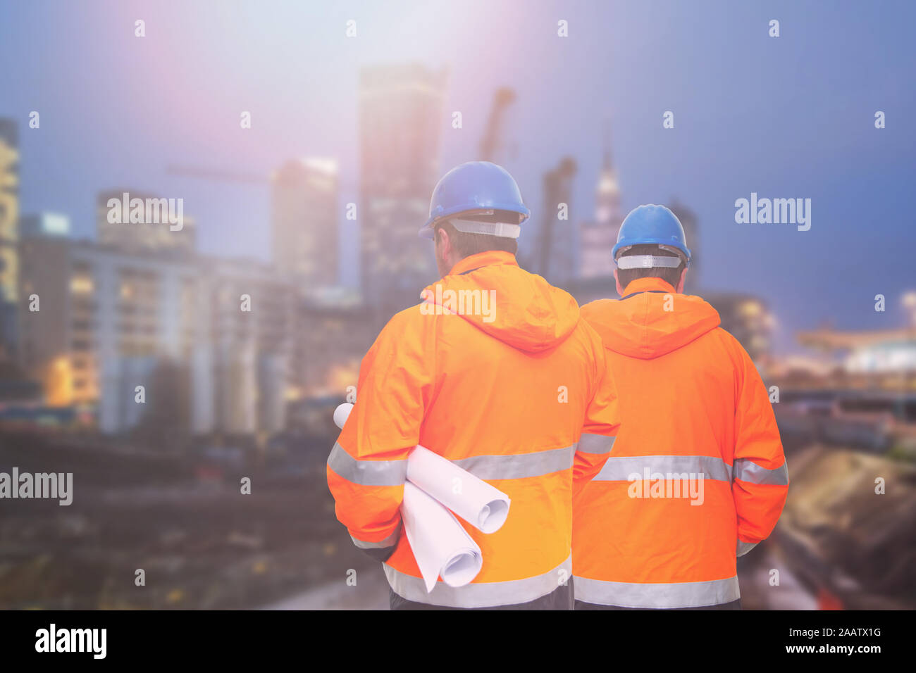 Two engineers looking at consrtuction site Stock Photo