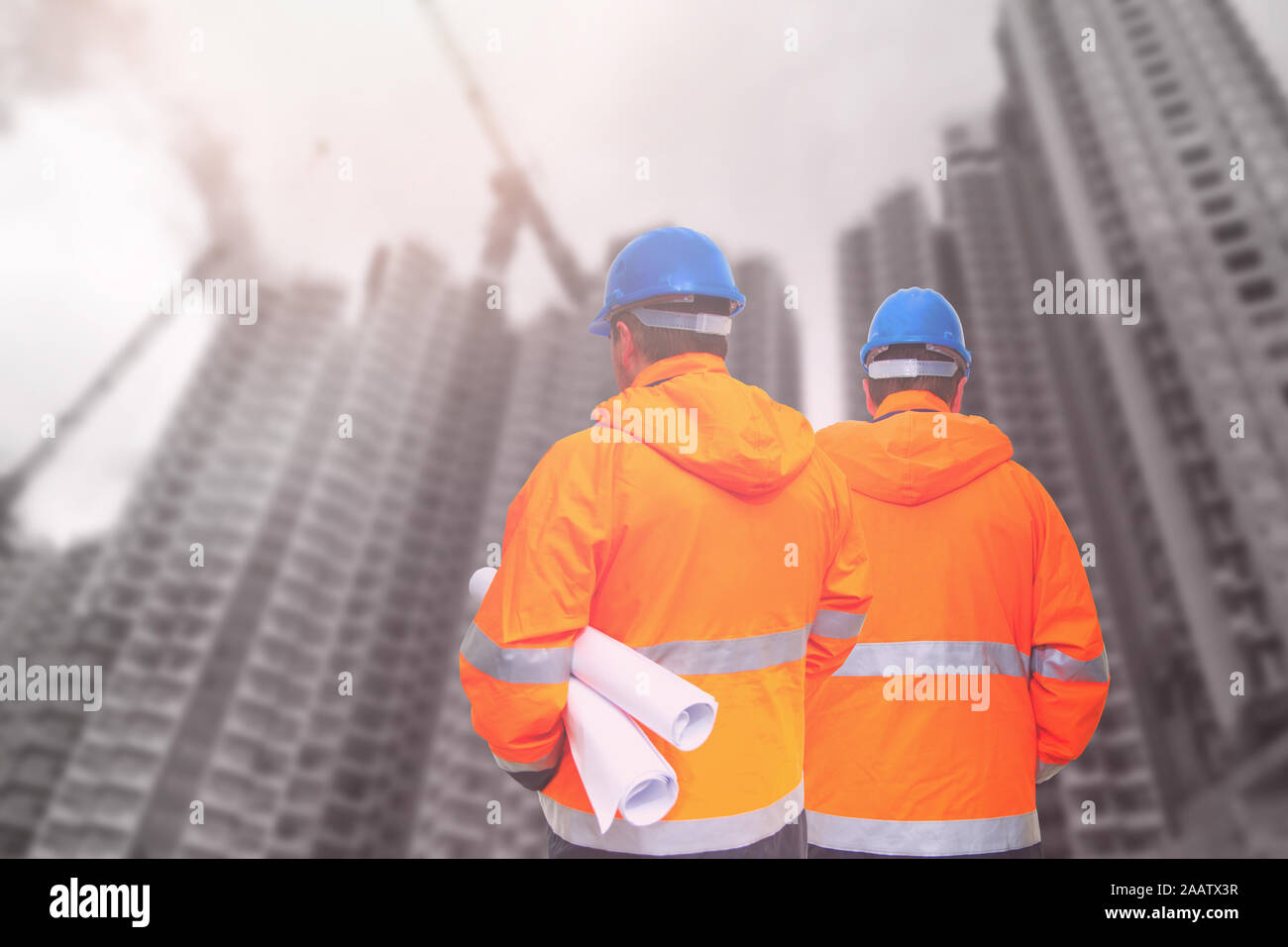 Two engineers looking at consrtuction site Stock Photo