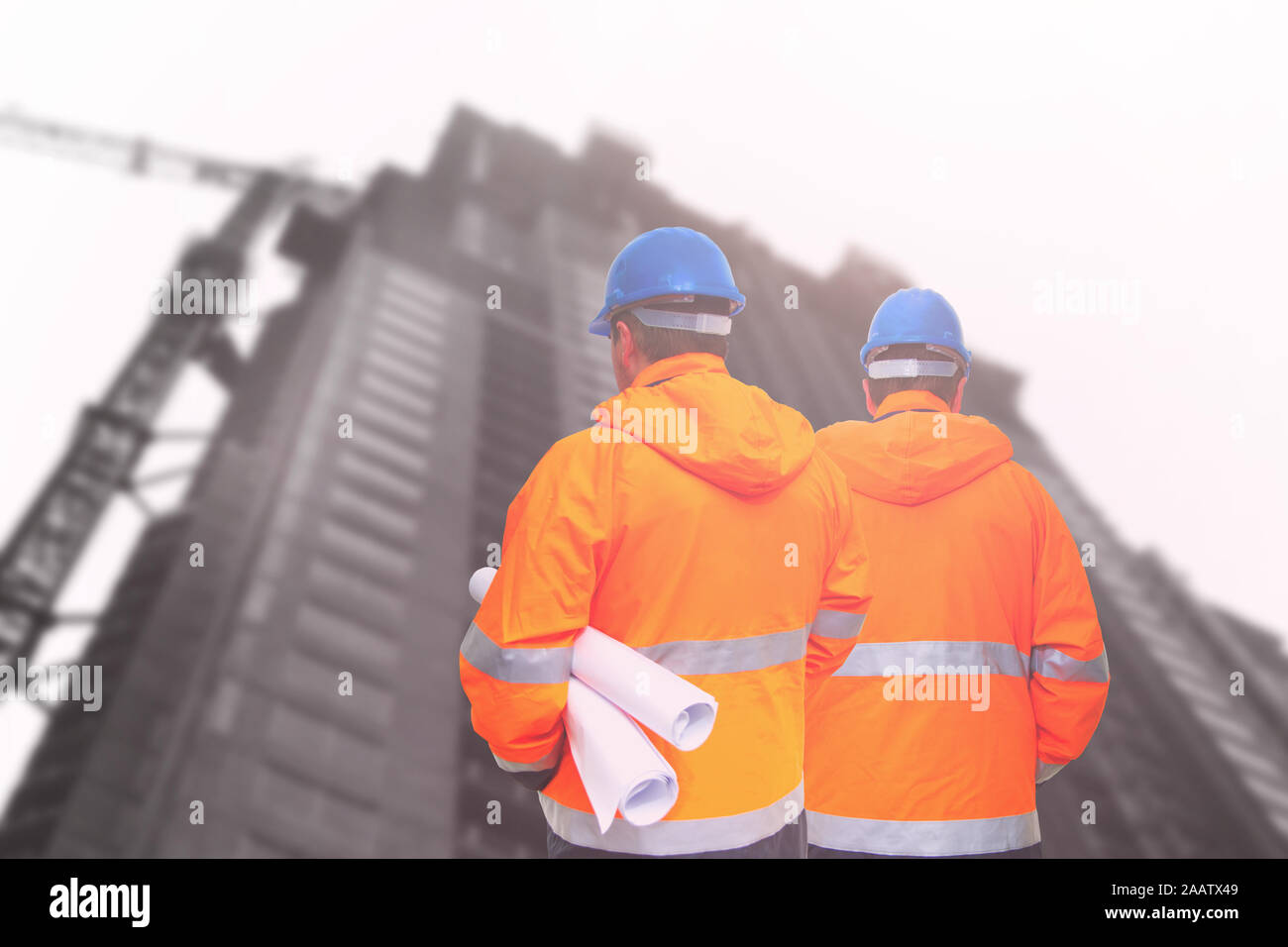 Two engineers looking at consrtuction site Stock Photo