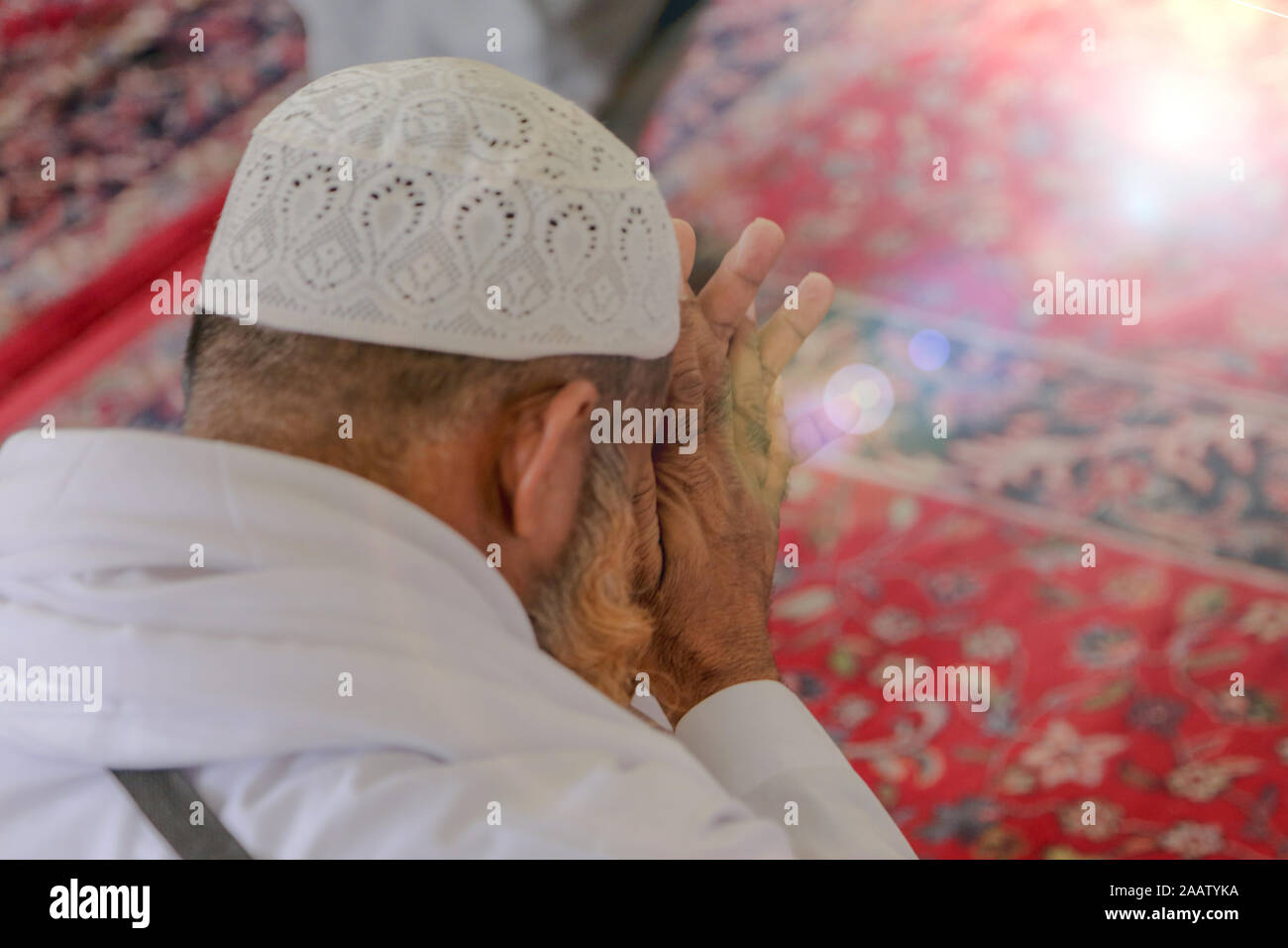 Old Muslim man praying Stock Photo