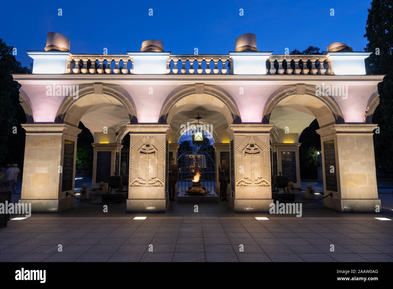 Tomb of the Unknown Soldier at night in city of Warsaw, Poland, located on Pilsudski Square, last surviving part of the Saxon Palace Stock Photo