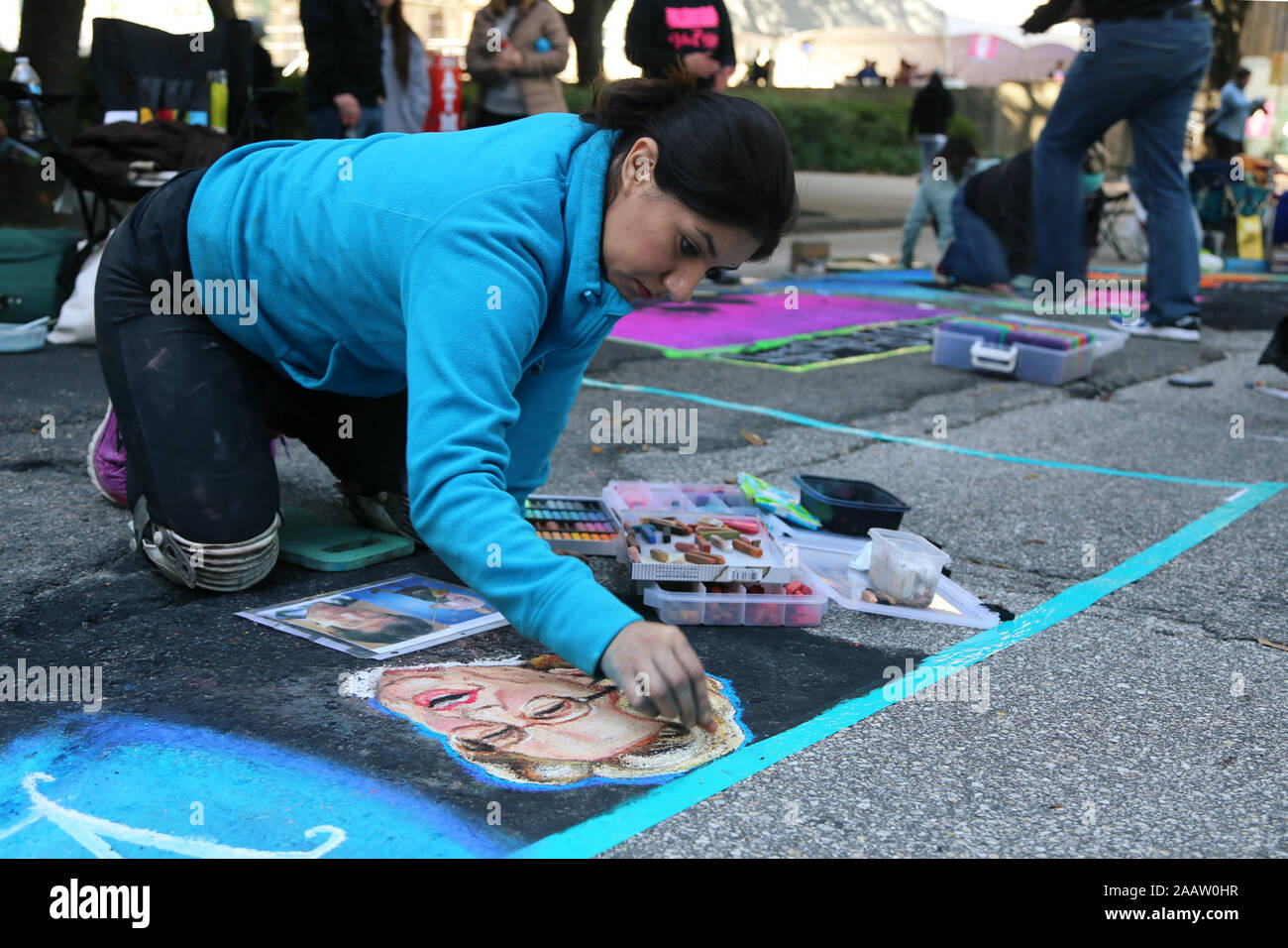 Houston, USA. 23rd Nov, 2019. An artist draws street paintings in Houston, Texas, the United States, on Nov. 23, 2019. More than 200 artists took part in this year's Houston Via Colori, one of the largest art festivals in the city, which is held to raise money for hearing-impaired children. Credit: Qiu Ma/Xinhua/Alamy Live News Stock Photo