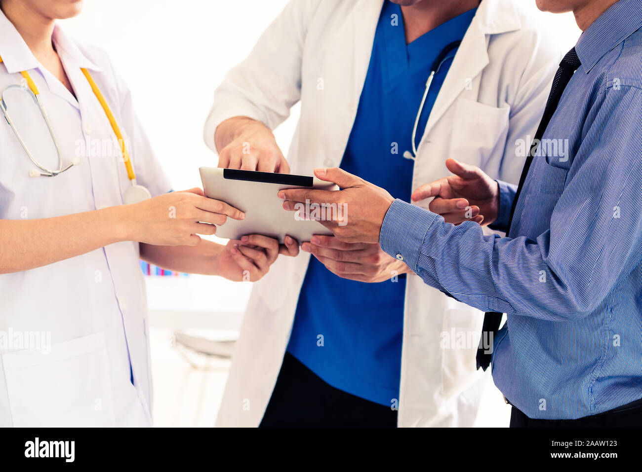 Healthcare people group and scientist meeting. Professional doctor working in hospital office with other doctors, nurse and businessman. Medical techn Stock Photo