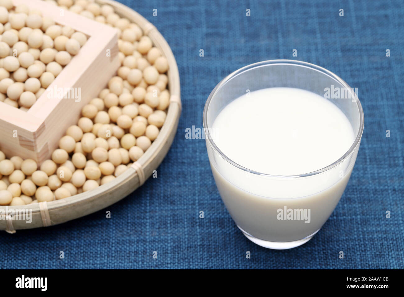 Glass of tonyu milk with soy bean on dining table Stock Photo