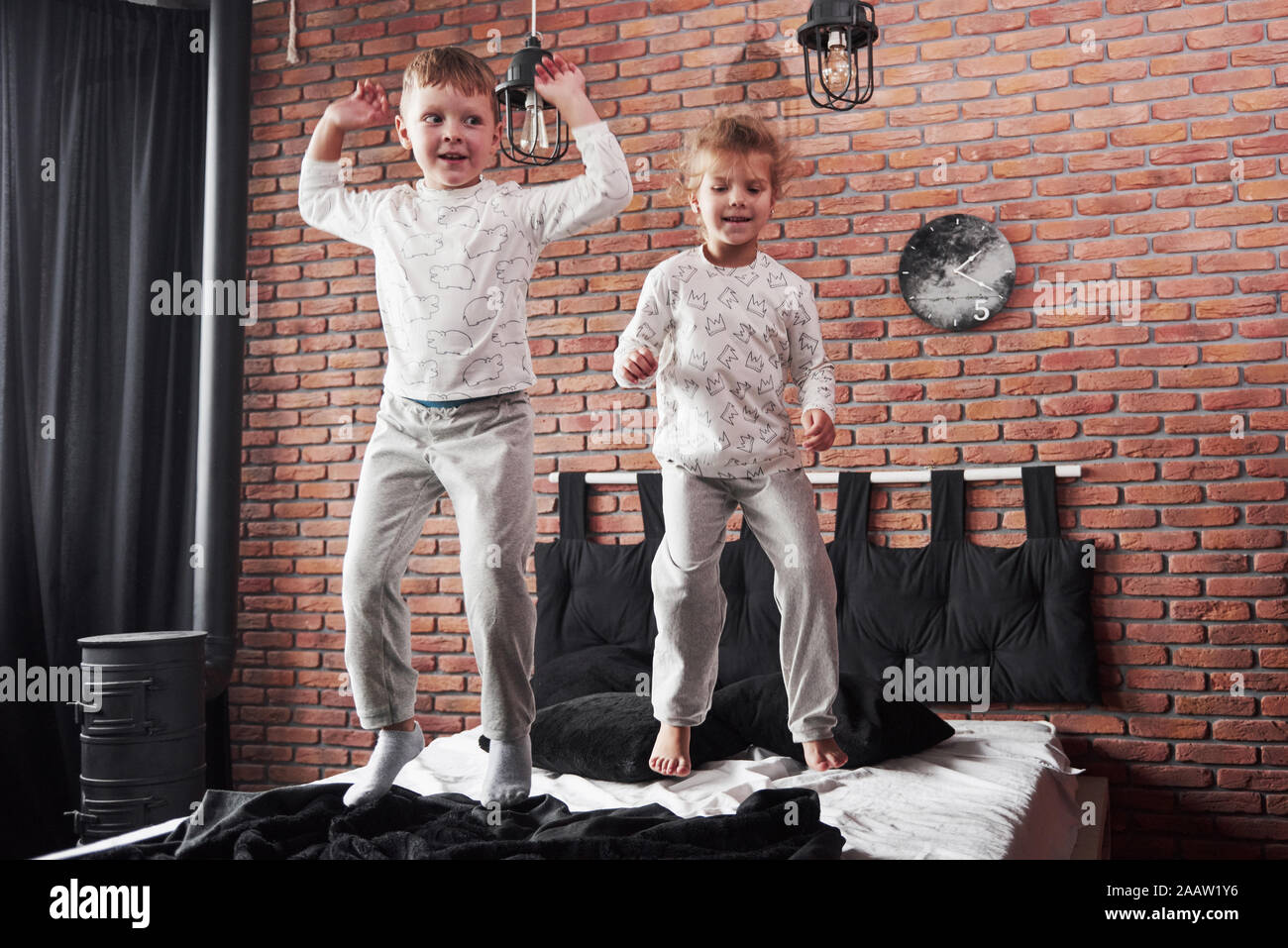 Naughty Children Little Boy And Girl Staged A Pillow Fight
