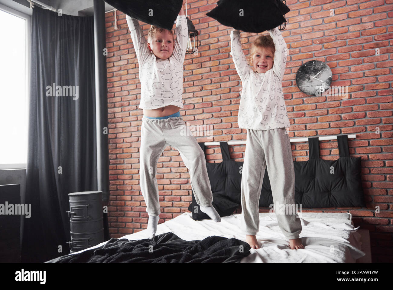 Naughty Children Little Boy And Girl Staged A Pillow Fight