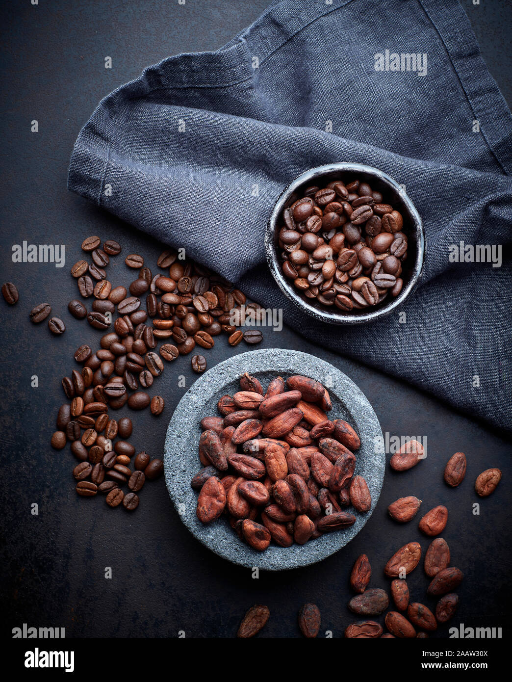 Bowls of cocoa and coffee beans Stock Photo Alamy