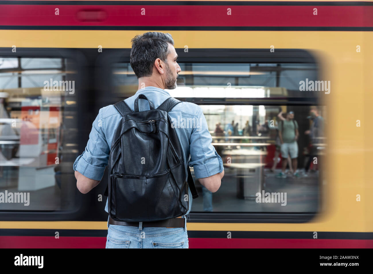 Caucasian man backpack in train hi-res stock photography and images - Alamy