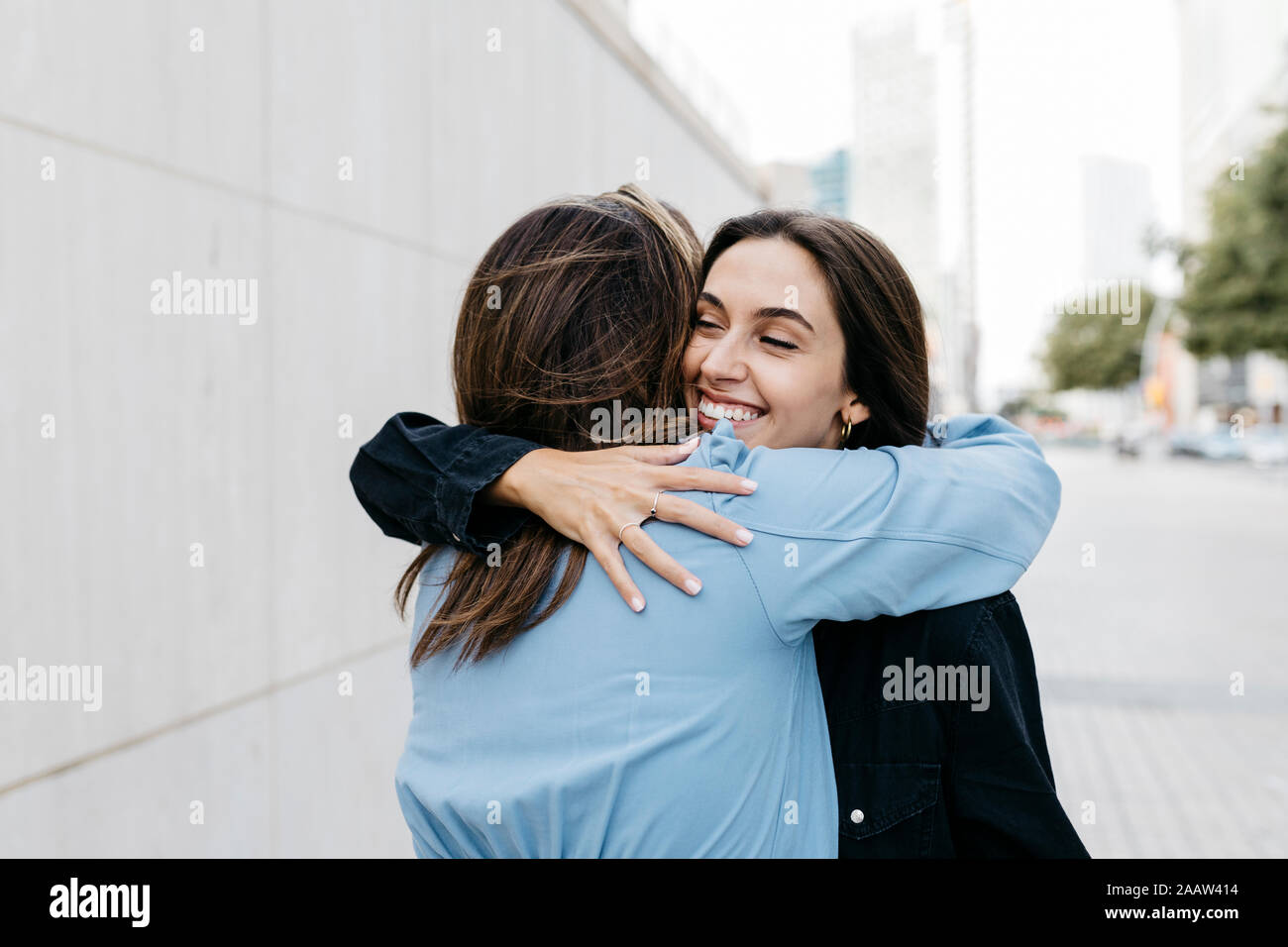 Two women hugging each other Stock Photo