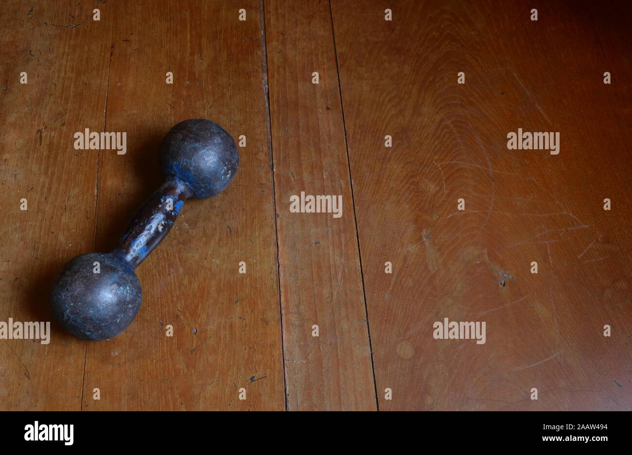 Closeup vintage dumbbell weighs about 3.5 kilograms, it is nearly 50 years old Stock Photo