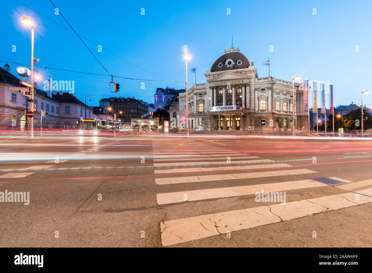 Light trails on street by Volkstheater in Vienna, Austria Stock Photo