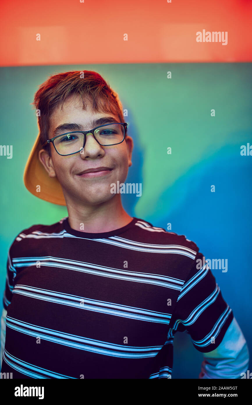 Portrait of smiling teenage boy in a photo booth Stock Photo